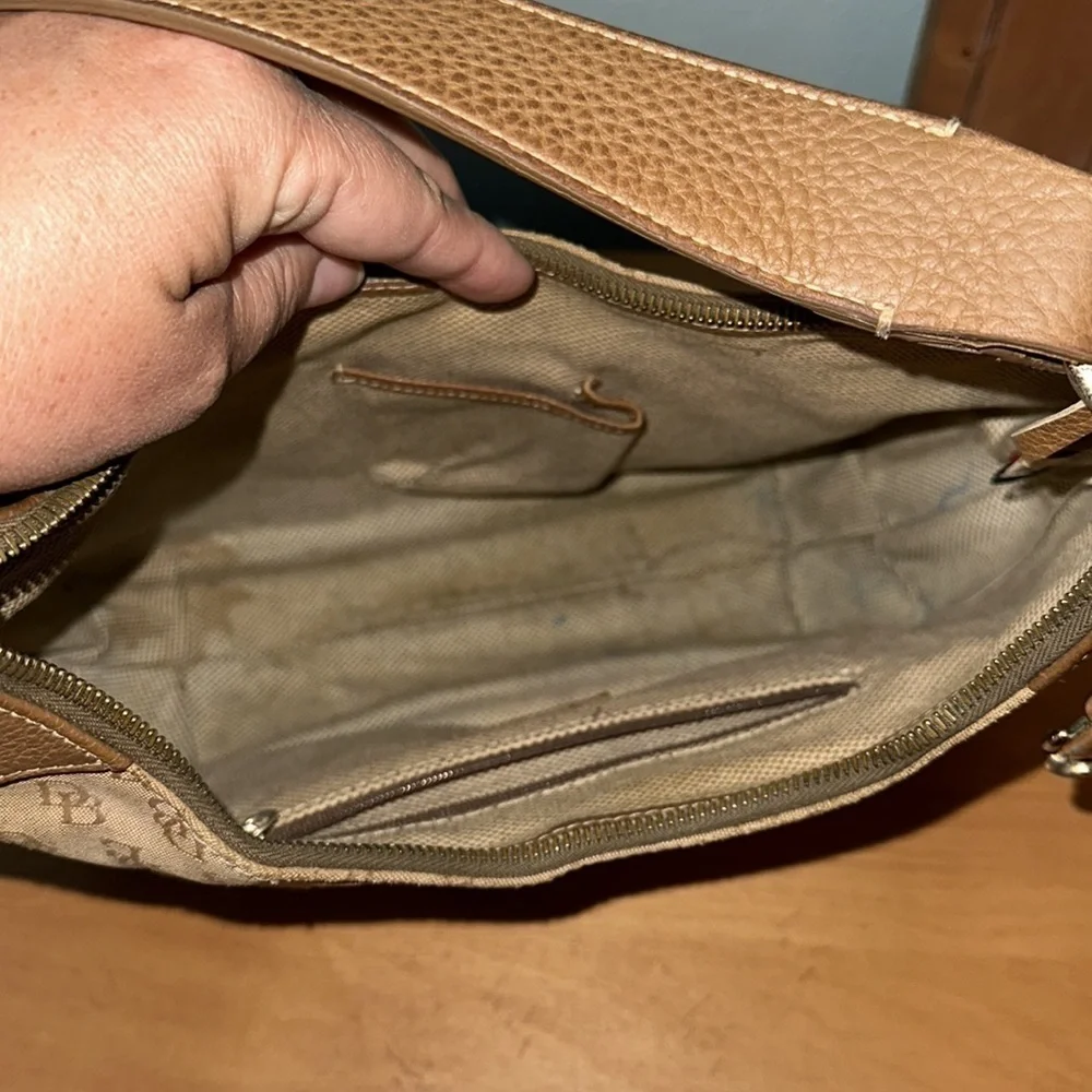 Dooney and Bourke classic monogram canvas and leather Tan color small hobo bag